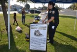 Lemoore PD Commander, Margaret Ochoa helps out at the annual Shoe Drive.